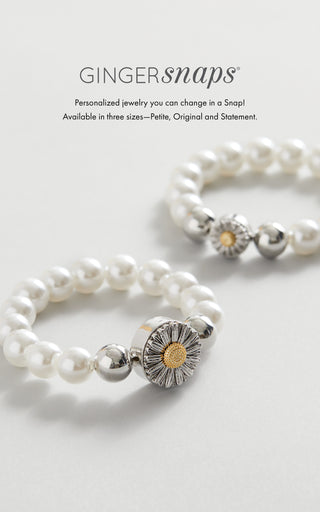 Ginger Snaps jewelry featuring two white beaded stretch bracelets and flower snap.