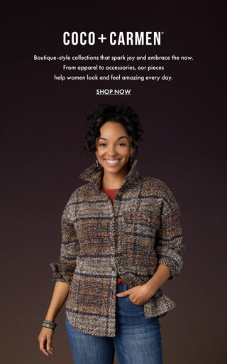 Model wearing fall outfit on dark background.