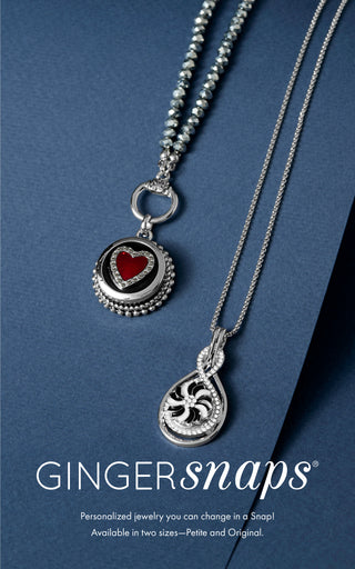 Two interchangeable snap jewelry necklaces on a blue background.