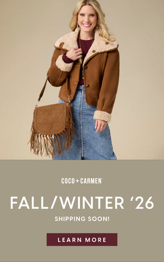 A woman models a brown shearling-lined jacket and a matching fringed shoulder bag against a beige studio background. The lower portion of the image contains a promotional banner reading 'COCO + CARMEN FALL/WINTER '26 SHIPPING SOON! LEARN MORE'.