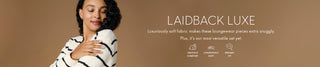 A woman in a black and white striped sweater is shown on the left against a warm brown background, with large white text on the right reading 'LAIDBACK LUXE' and smaller product feature text below.