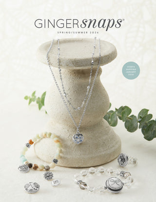 Jewelry set on a stone stand with 'Gingersnaps' branding