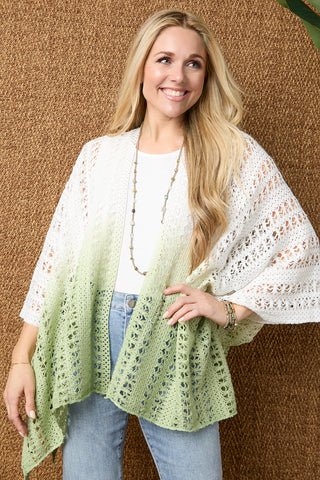 Model wearing white and green ombre wrap on a tan textured background.