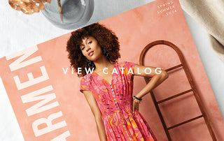 Coco + Carmen Spring/Summer '24 Catalog cover. Model wearing pink and orange summer dress.