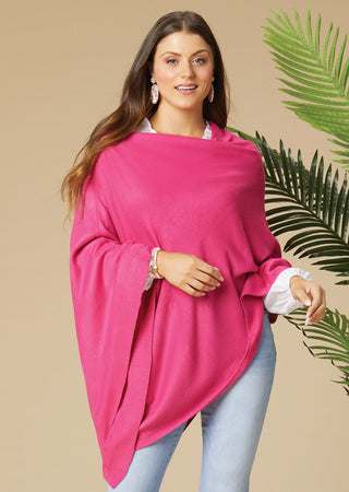 Model wearing a bright pink lightweight poncho.