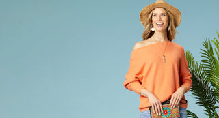 Model wearing bright orange long sleeve summer sweater. Shop best sellers.