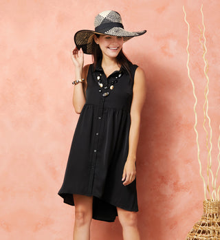Model wearing a black button-down, sleeveless summer dress and black/cream ranch hat.