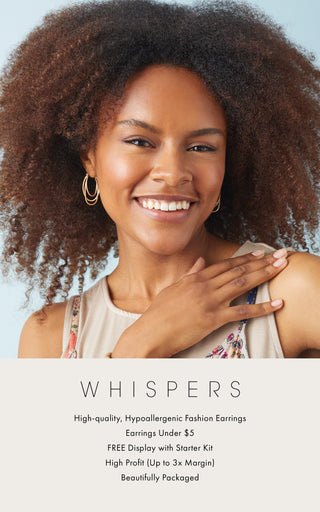 Shop Whispers Spring/Summer '25. Woman model wearing multi-oval hoop earrings.