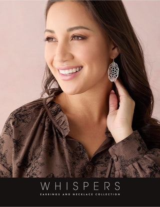 Woman wearing a silver earring with 'Whispers' branding on a pink background