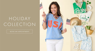 Woman wearing a blue shirt with 'USA' text, surrounded by holiday-themed decor and products.