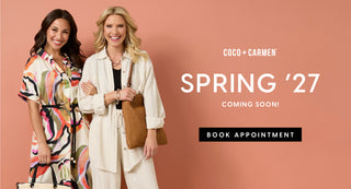 Two women posing together with a 'Spring '27' promotional banner on a pink background.