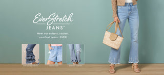 Woman wearing light blue jeans with EverStretch branding on a green background